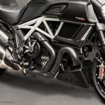 A close up of the front wheel on a motorcycle.